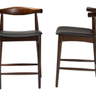 Baxton Studio Eira Counter Stool Set of 2- Walnut Wood Frame Counter-height Chair with Curved Backrest and Black Faux Leather Seat, Mid-Century Modern Kitchen Island Seating