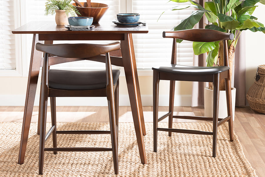 Baxton Studio Eira Counter Stool Set of 2- Walnut Wood Frame Counter-height Chair with Curved Backrest and Black Faux Leather Seat, Mid-Century Modern Kitchen Island Seating