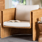 bali & pari Carina Natural Rattan Armchair with Cushion - Handwoven Lounge Chair with U-Shaped Silhouette and Deep Seating for Boho, Coastal, or Tropical Living Spaces
