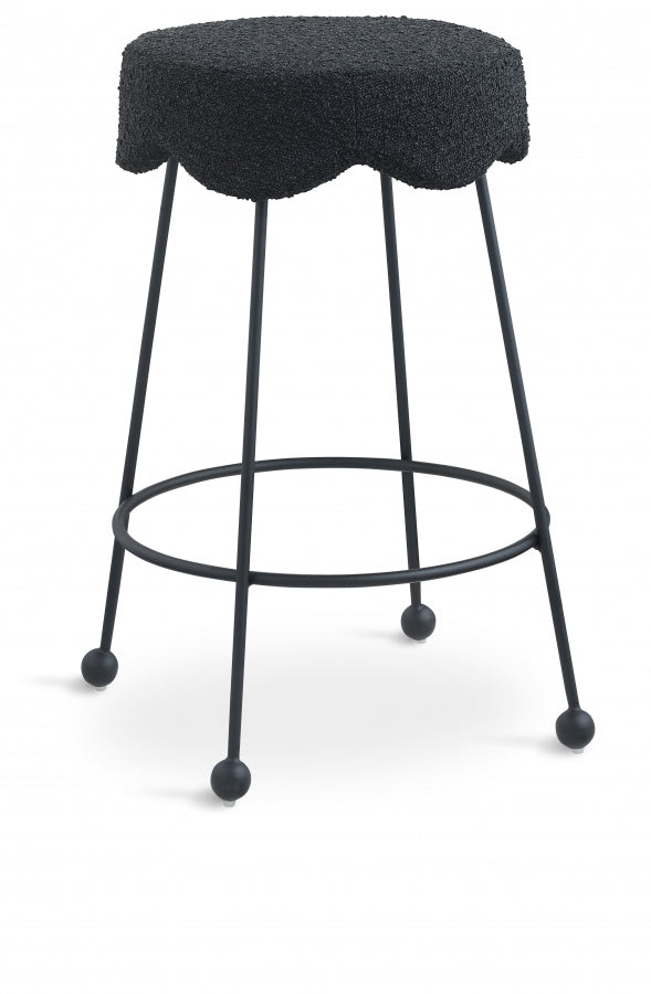 Black bar stool with a textured cushioned seat on a white background