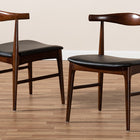 Baxton Studio Eira Mid-Century Modern Black Faux Leather Upholstered Walnut Finished Wood Dining Chair Set of 2