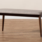 Baxton Studio Flora Mid-Century Modern Light Grey Fabric Upholstered Walnut Finished Wood Dining Bench