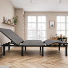 Ergomotion ADAPT Adjustable Bed in a room with large windows and minimal decor.
