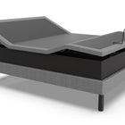 Ergomotion ASCEND High-Low Adjustable Bed with raised headboard on a white background.