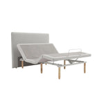 Ergomotion SmartSense gray adjustable bed with modern headboard.