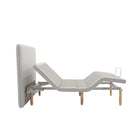 Ergomotion SmartSense gray adjustable bed with modern headboard side view.