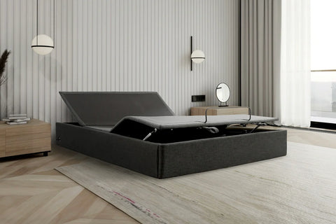 Ergomotion STOW Storage Adjustable Bed with lifting headboard on a white background.